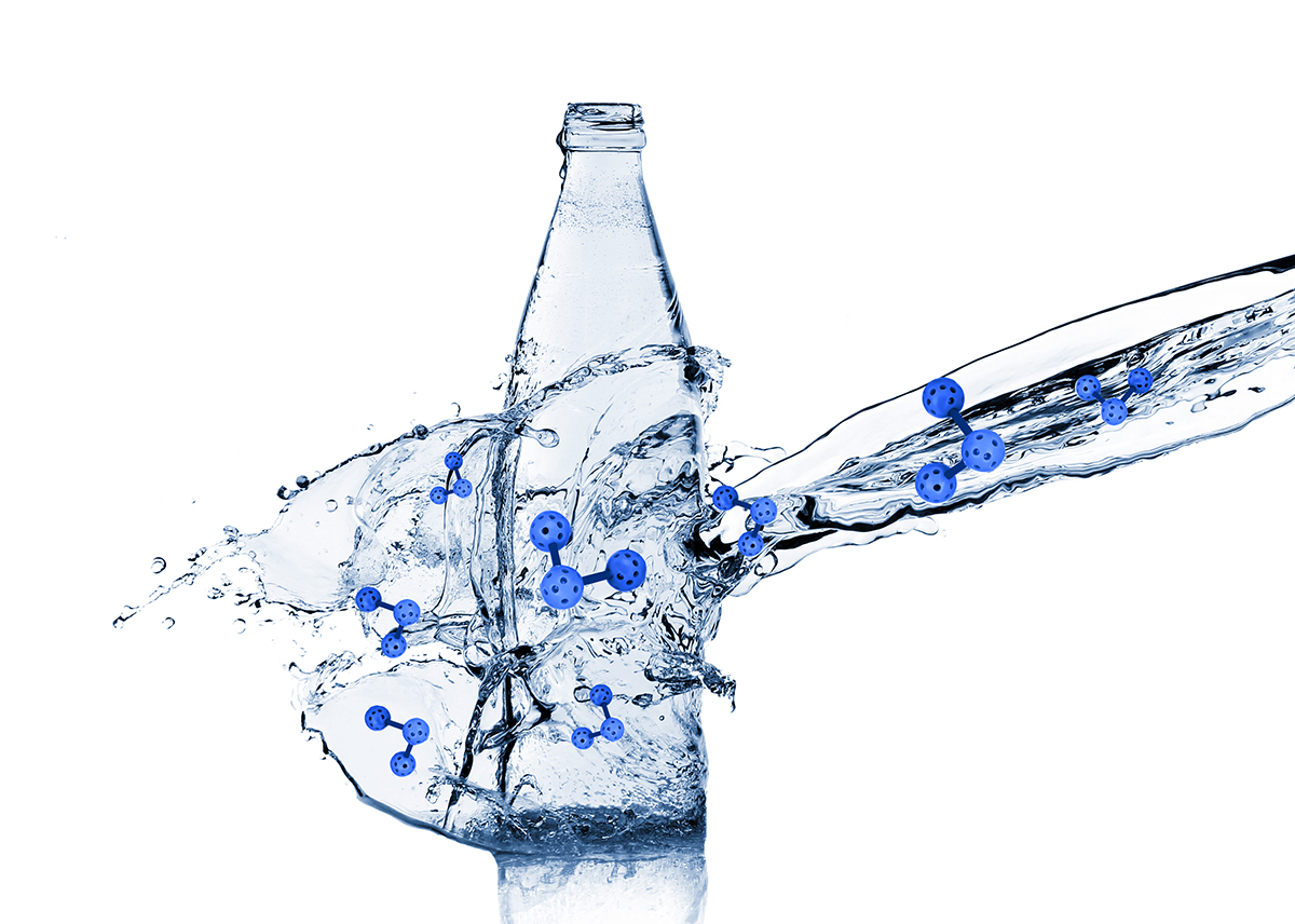 Splashing water onto bottle on white background. Health care concept